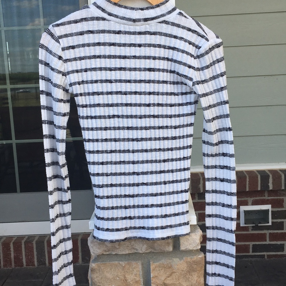 Striped black and white turtleneck sweater